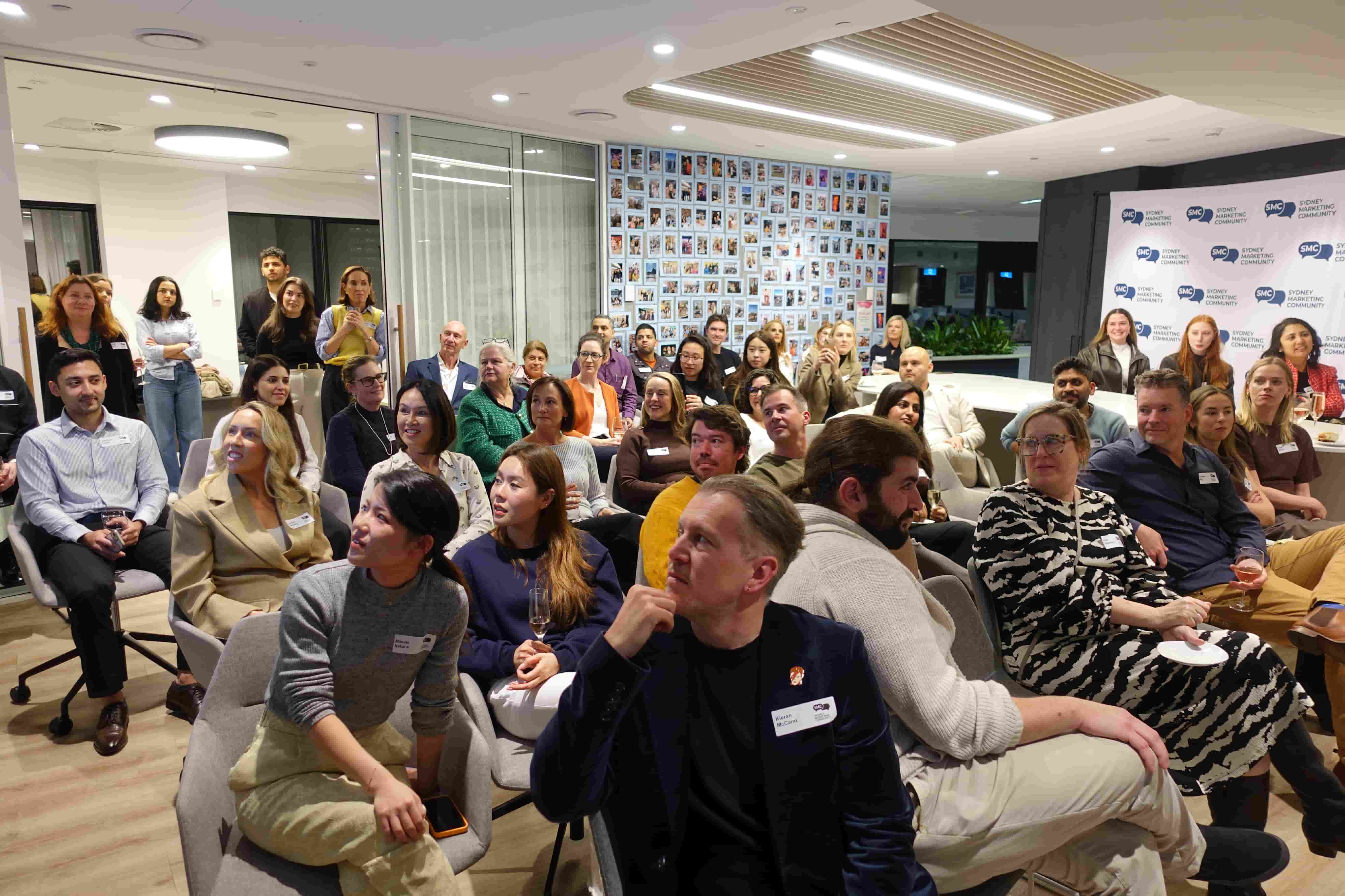 A group of people watching a presenter